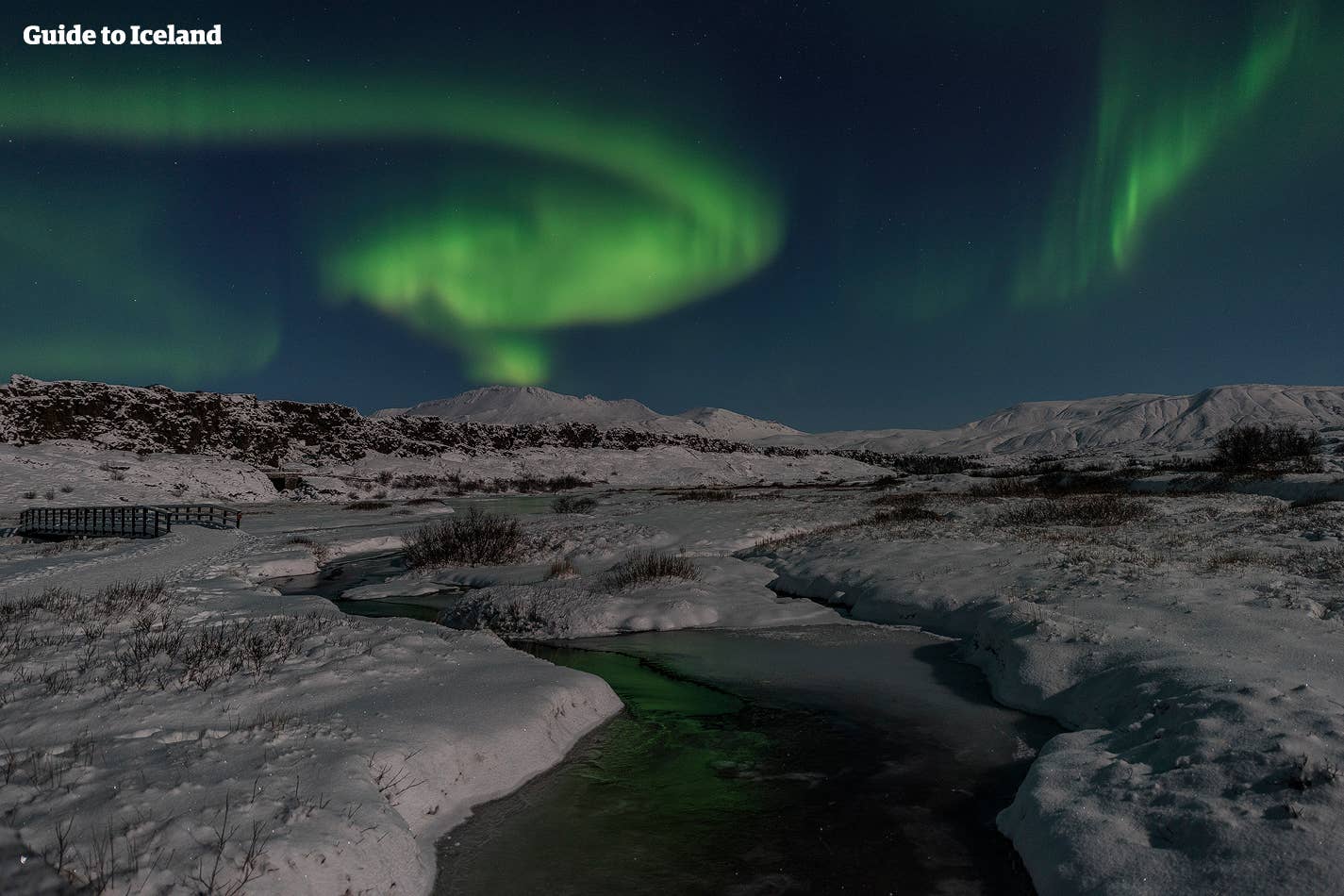 Auroras dancing on the Golden Circle, over Þingvellir National Park in Iceland