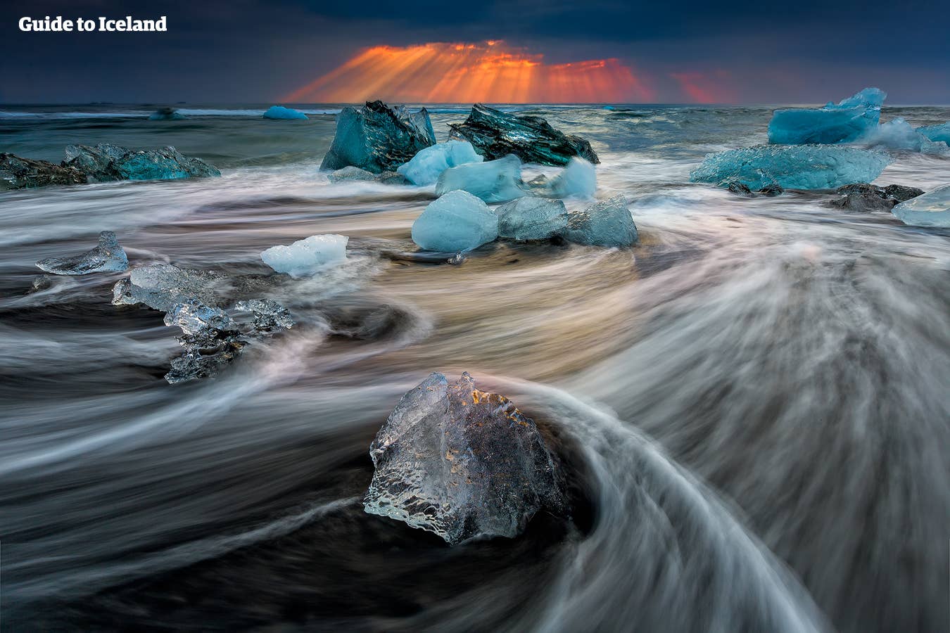 Light, ice, black sand and sea interplay by Jökulsárlón glacier lagoon in Iceland