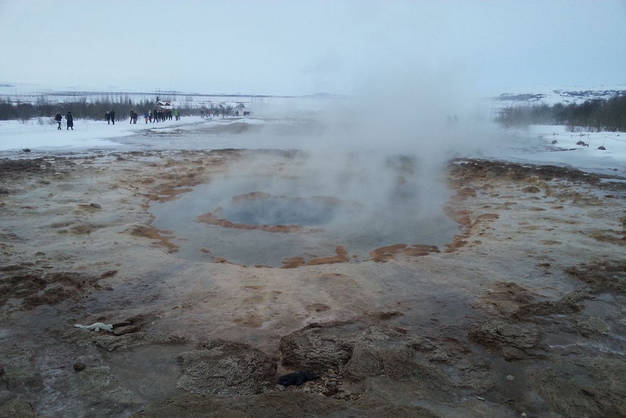 Geysir Geothermal Area near Faxafoss Waterfall in Iceland with steaming hot springs on the Golden Circle Route.