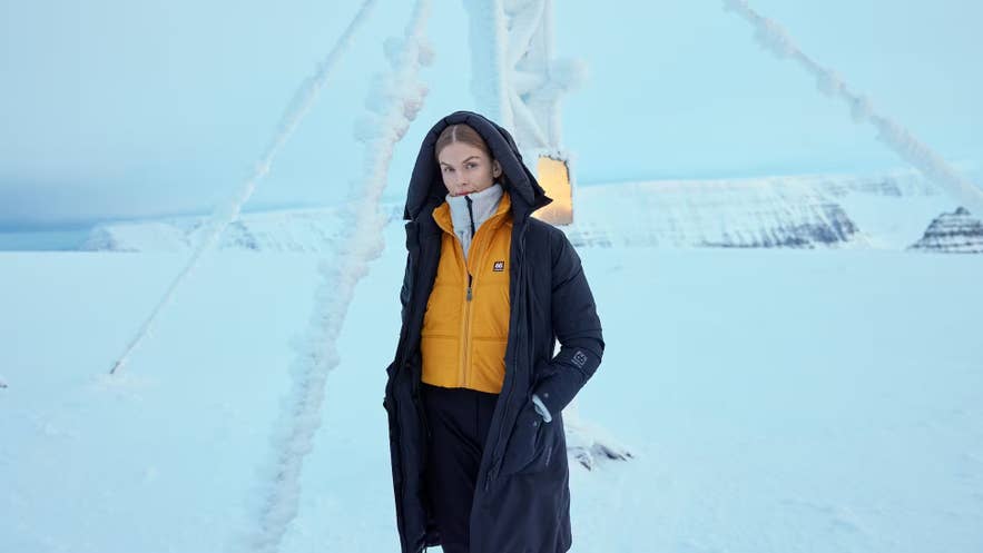A traveler dressed in warm layers for Iceland weather