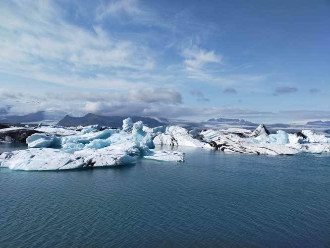Icebergs float gracefully in Jokulsarlon glacier lagoon.