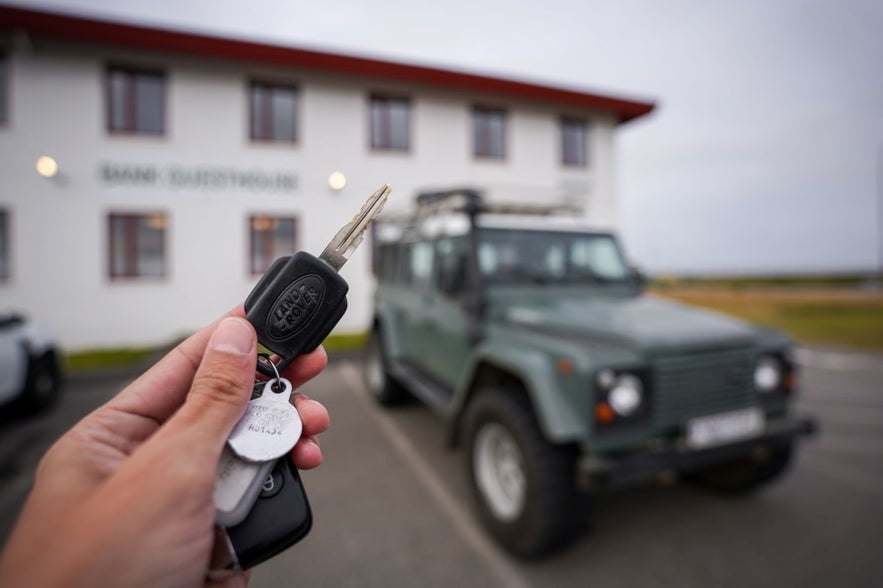 The key to a 4x4 vehicles with the car in the background.