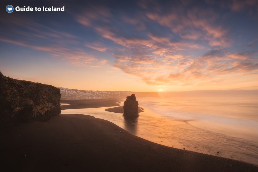 Reynisfjara black sand beach at sunset in Iceland.