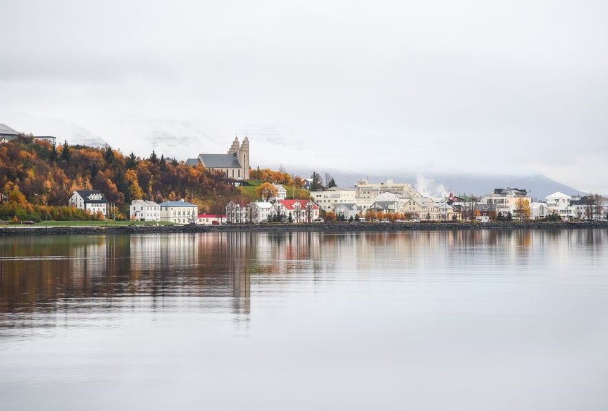 The Akureyri church and iconic buildings of the town nestle by the coast.