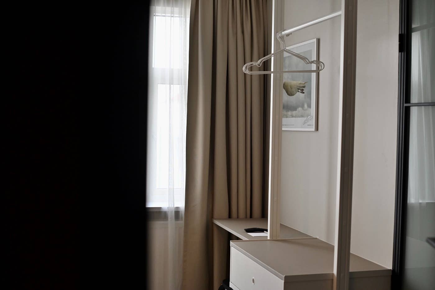 A room corner with clothes hanger at Local 101 hotel.