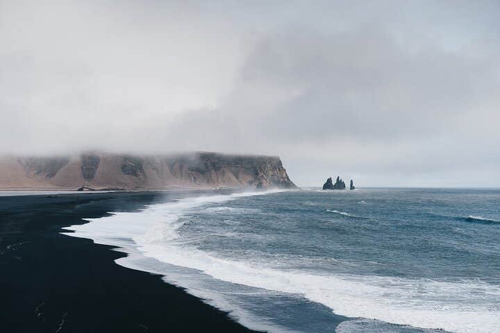 The South Coast region is famous for its long stretches of black sand beaches.