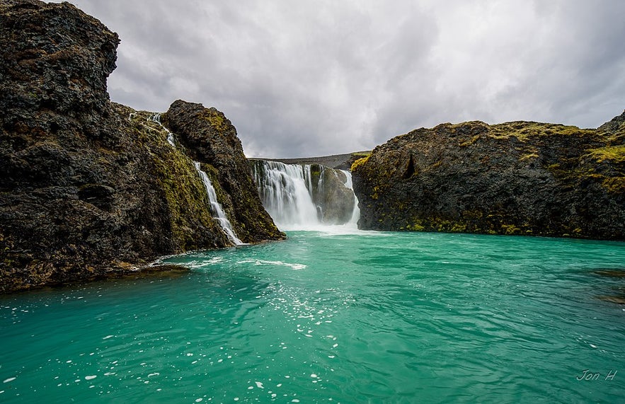 The blue waters of the Sigoldofuss waterfall in South Iceland.