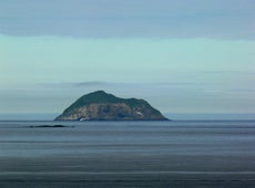 Skrudur island rises beautifully off the coast of East Iceland.