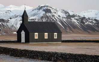 Budir church looks striking with its black exterior contrasting beautifully against the natural surrounding landscape.