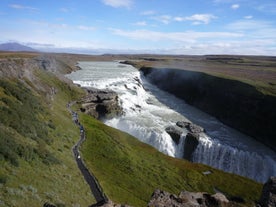 Gullfoss waterfall has a massive cascade dropping into a canyon.