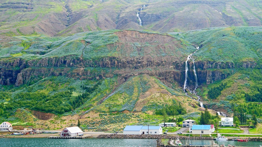 Strandartindur’s meltwater feeds the Budara River, which cascades down the hillside and into the Seydisfjordur fjord below.