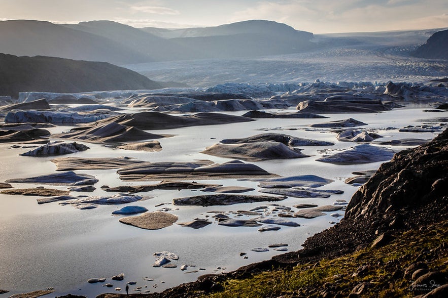 Icebergs float in the glacier lagoon at the tongue of the Hoffellsjokull ice cap.