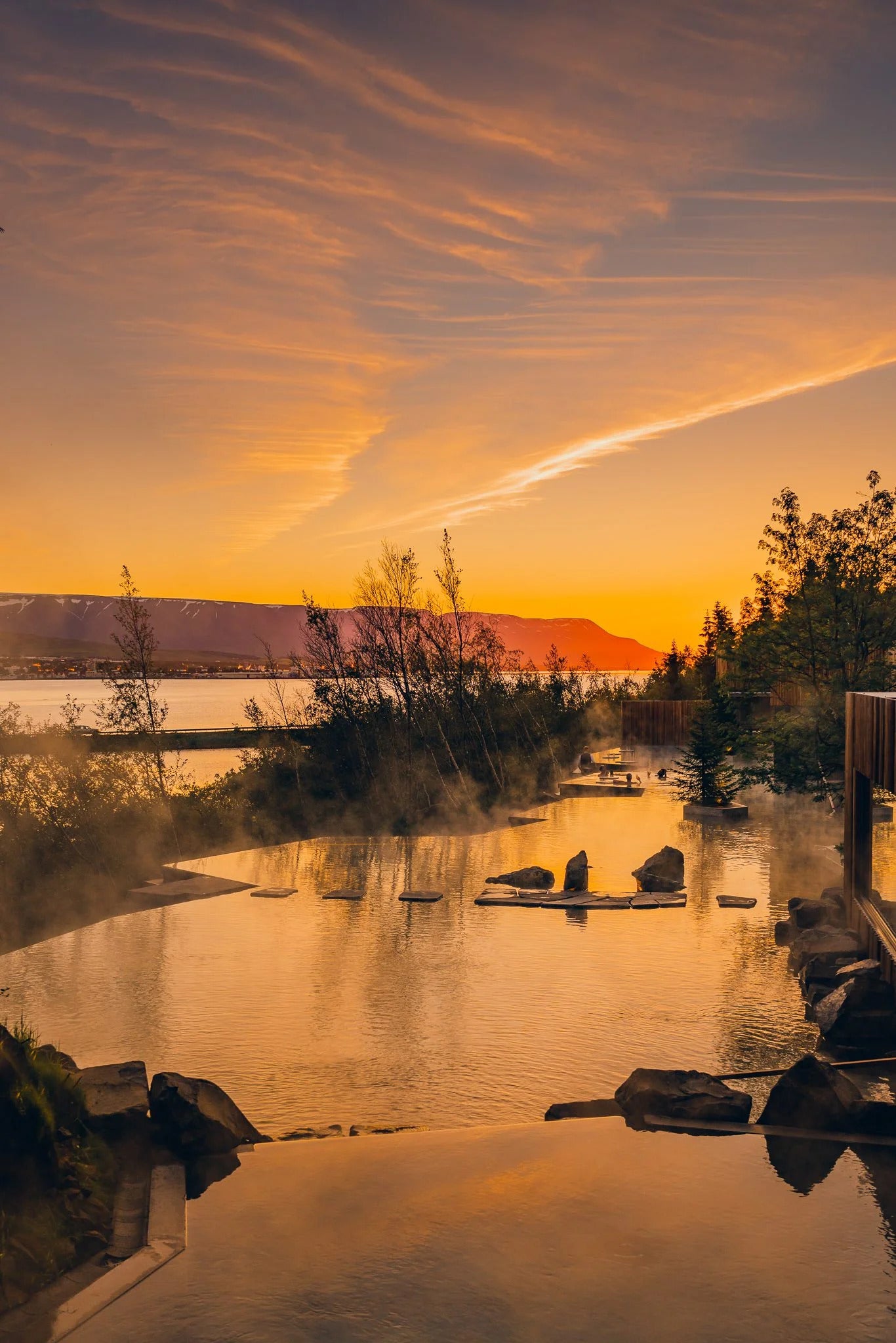 The large pool at the Forest Lagoon near Akureyri boasts an incredible fjord-side setting and is an idyllic spot to unwind at sunset.