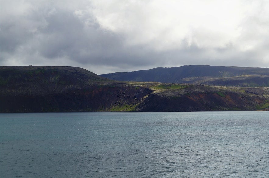 Heidarvatn lake in South Iceland is a tranquil fishing destination surrounded by rugged landscapes, offering anglers a serene retreat amidst nature's beauty.