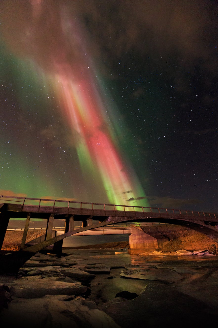 Northern Lights over the river Laxá in Hvalfjordur