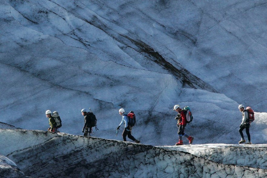 Icelandic rescue team hiking up a glacier to help a hurt skier