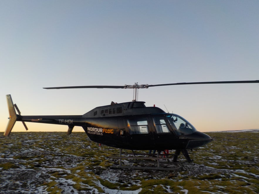 Norðurflug helicopter on mountain Esjan by Reykjavík