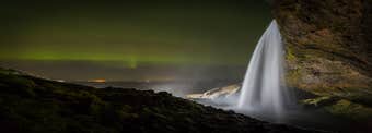 Seljalandsfoss surrounded with Northern lights
