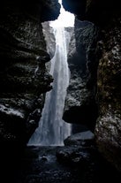A mighty waterfall hidden in Nauthúsagil gorge on the South Coast of Iceland.
