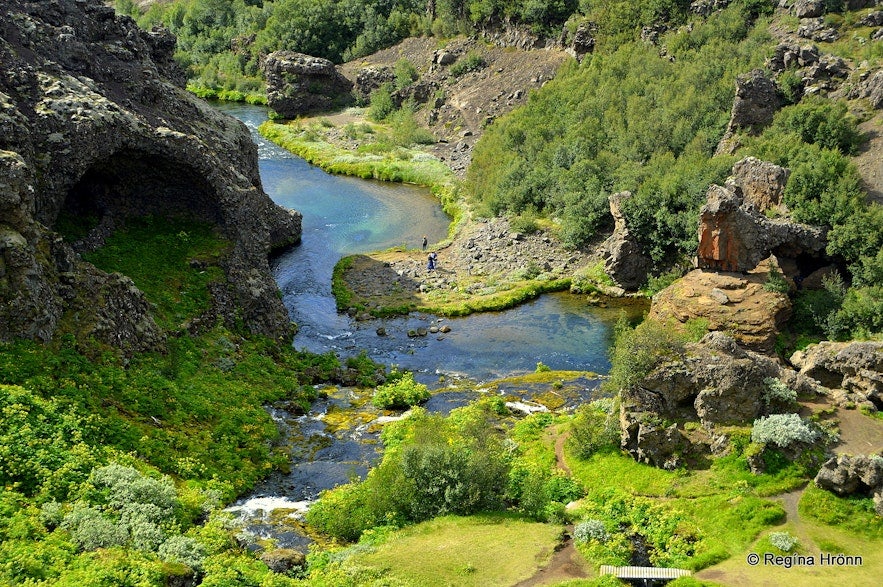 Gjarfoss waterfall is in the Gjain valley, a lush oasis with diverse natural features.