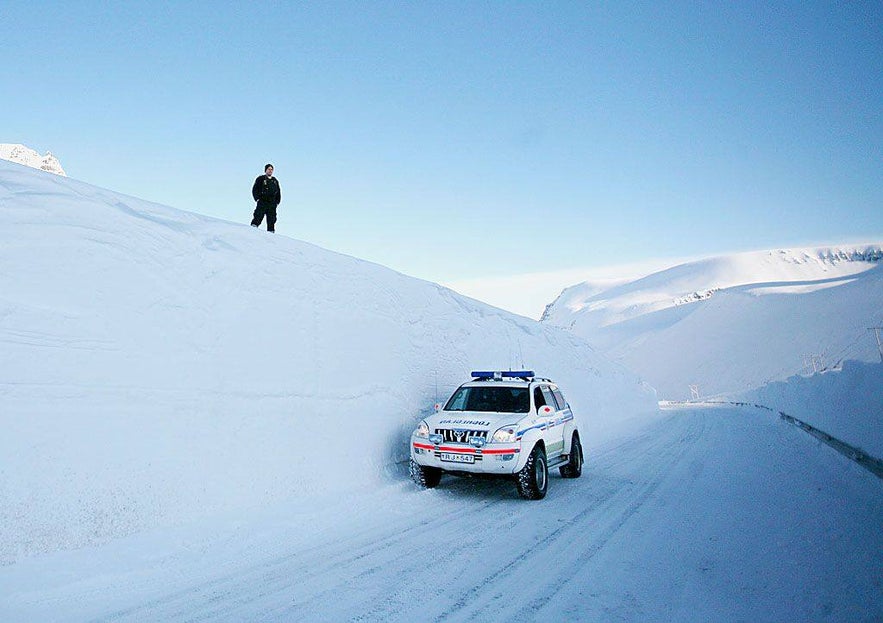 Police car driving in the Westfjords