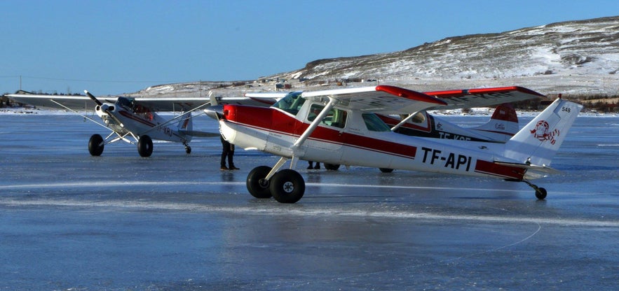 #Airplanes landing on frozen lake in Iceland 