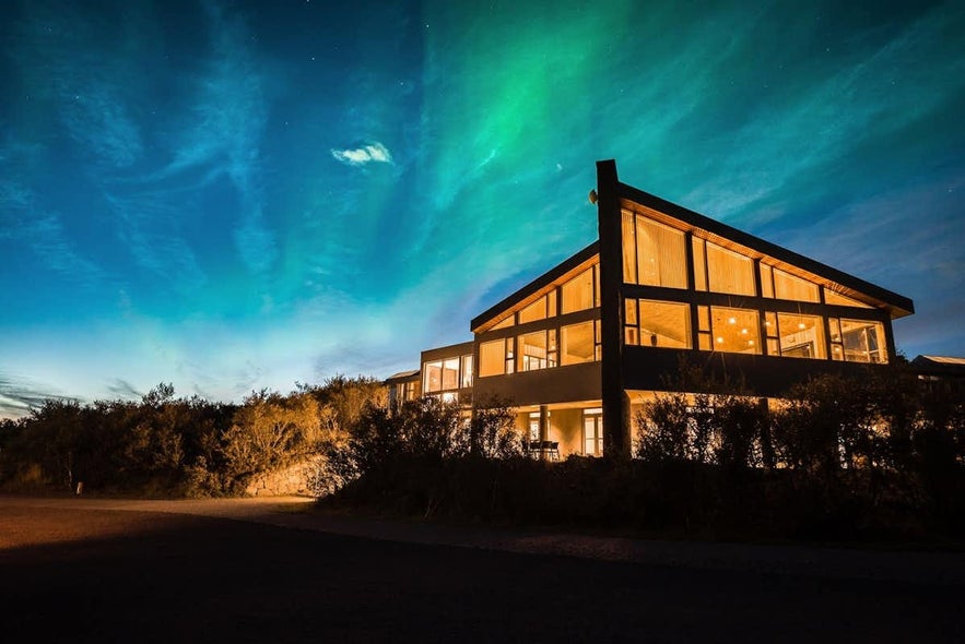 The aurora borealis dances over Hotel Husafell.