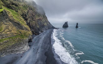 The South Coast boasts long stretches of black sands.