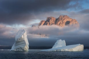 Going on a photography workshop to Greenland ensures spectacular shots of icebergs and steep mountain cliffs.