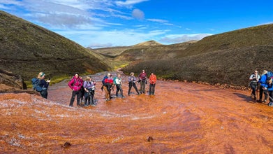 Travelers take a break from hiking and strike a pose along the Laugavegur trail.