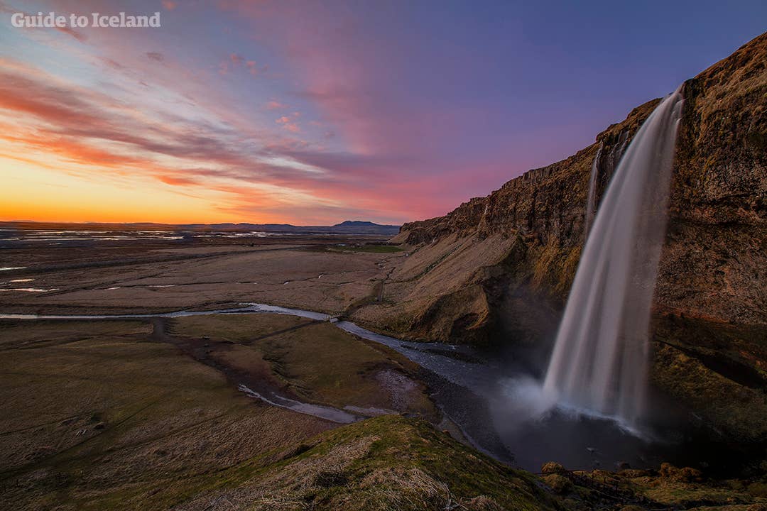 The midnight sun casts its soft light on Seljalandsfoss. 