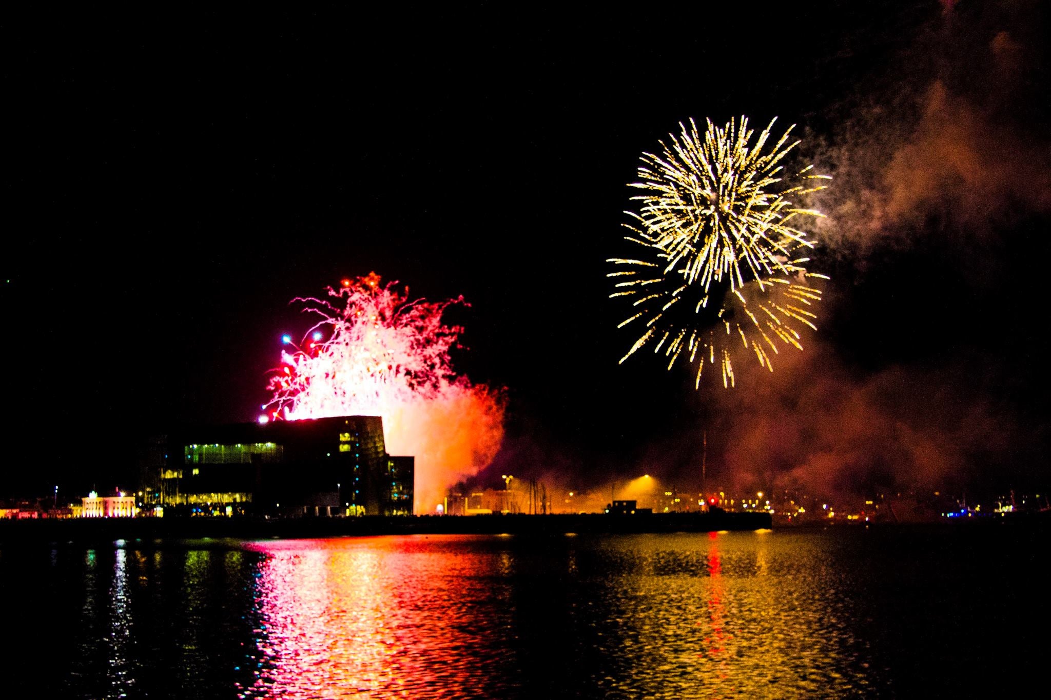 The Harpa Concert Hall as seen from the waters of Faxaflói Bay in Reykjavík at year's end.