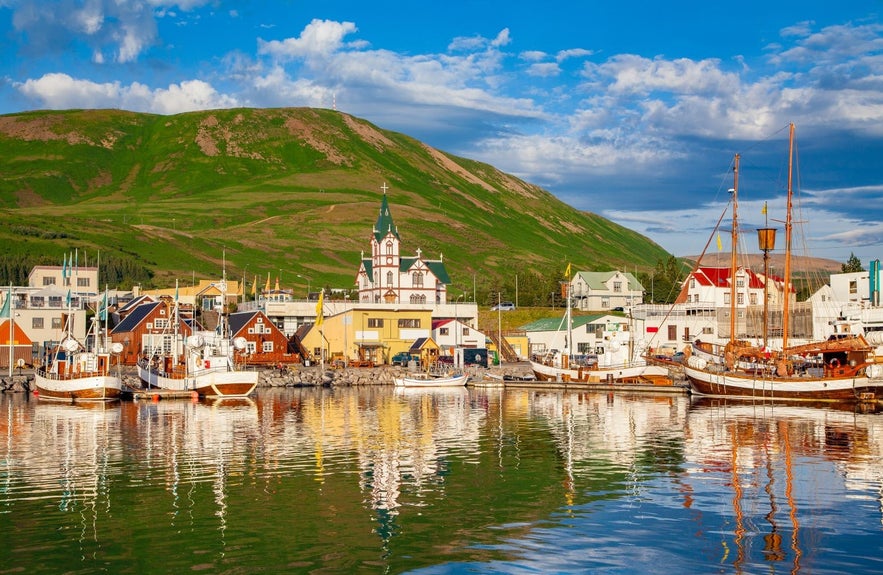 Husavik has a beautiful harbor with colorful boats.