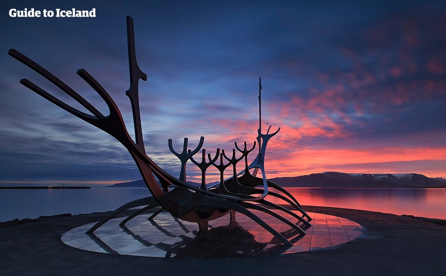  Sólfarið (Ship of the Sun) by Reykjavík's coastline. Mount Esja is bathed in red across the bay. 