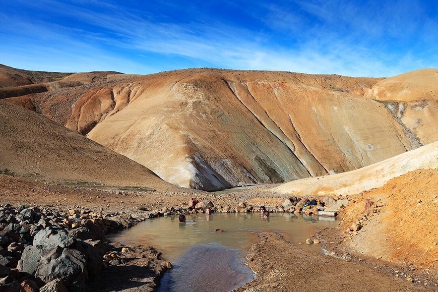 The geothermal area of Hveradalir is known for its vibrant colours and warm pools.