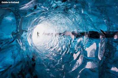 A naturally formed ice-tunnel inside of one Iceland's enormous glaciers.