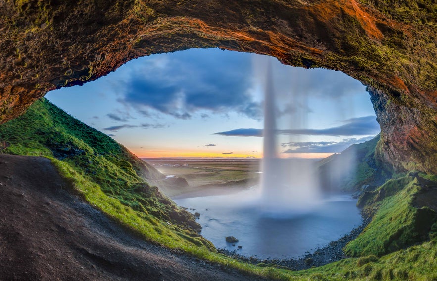 The view from behind Seljalandsfoss waterfall.