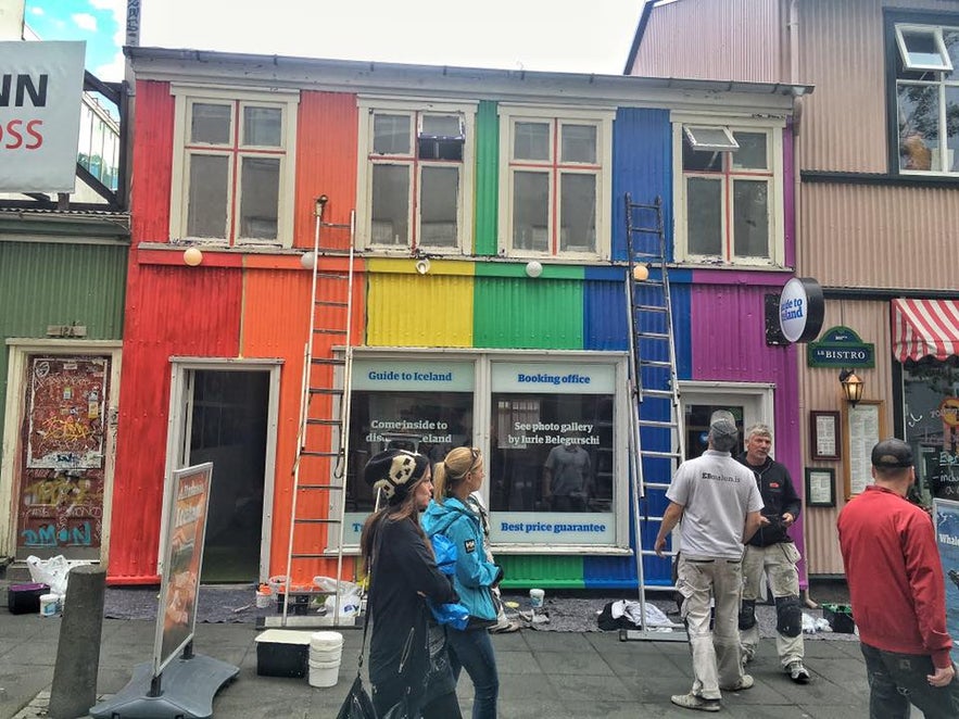 Painters working on the new rainbow look of Guide to Iceland's office