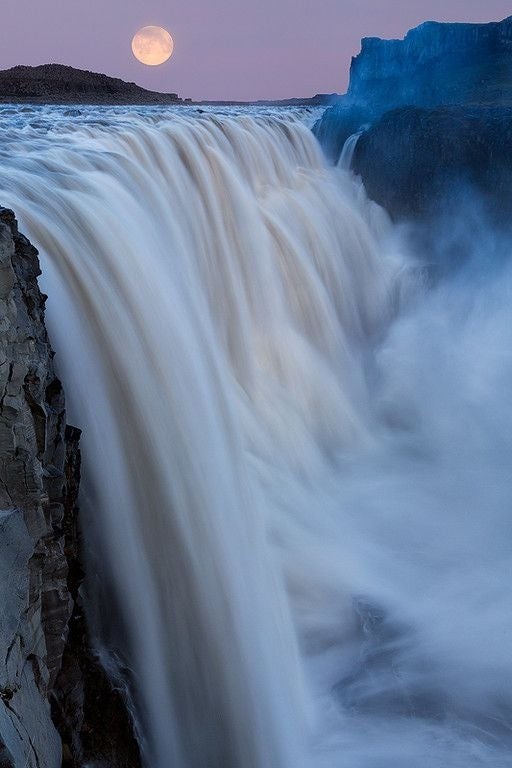 Supermoon over Dettifoss waterfall in north Iceland