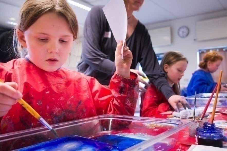 Children making crafts in the Reykjavik City Library, Iceland