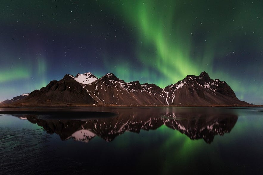 Vestrahorn mountain and Northern Lights in east Iceland