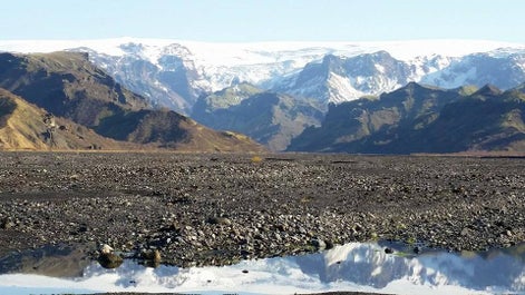 A view over lava in Vatnajökull National Park to the mighty Vatnajökull glacier.