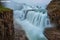 Long-exposure photo of Gullfoss waterfall on a cloudy day