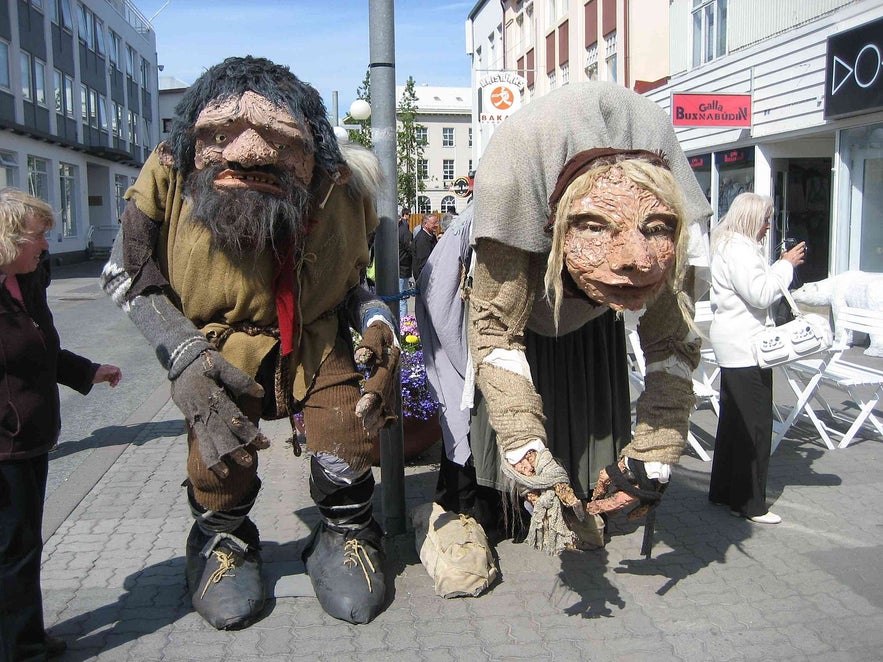 These Icelanders, pictured with two tourists, are from Akureyri; you can tell because they do not burn your eyes to look upon.