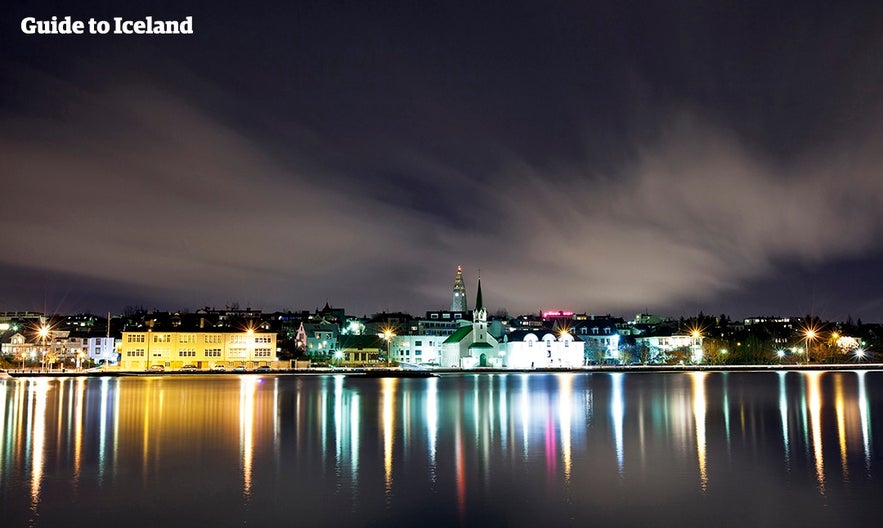 Reykjavik by night, taken from across the city pond.