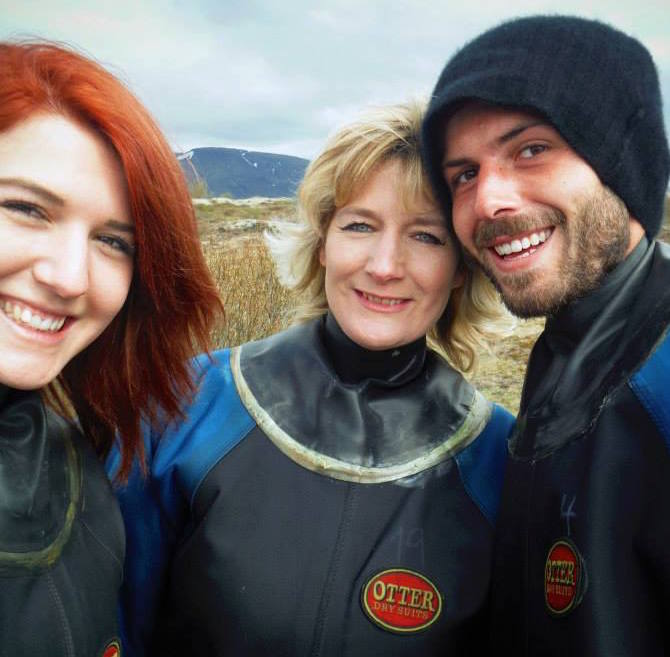 You cannot tell in the drysuits, but all three pictured are women.