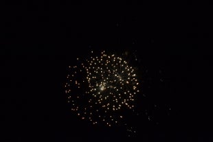 A fireworks explosion in the sky above Reykjavik at midnight on New Year’s Eve.