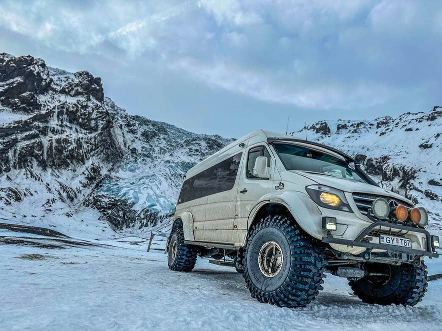 Super jeep tour heading toward Katla Ice Cave in snowy conditions.