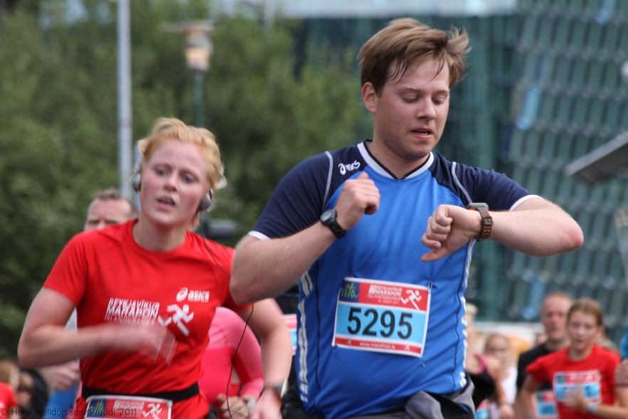 Contestants in the Reykjavik Marathon pass through downtown Reykjavik