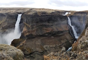 Haifoss and its neighboring cascades plunge from a tall cliff.